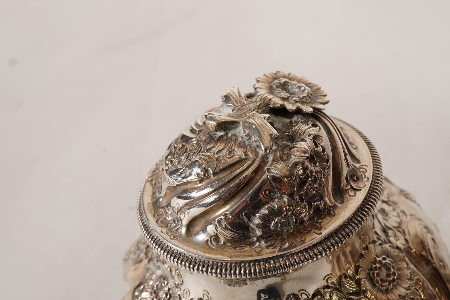 A pair of George II silver tea caddies and matching sugar box with covers, by Samuel Taylor
